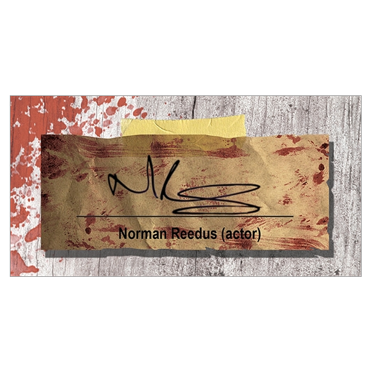 Zoomed in closeup view of Norman Reedus autograph reproduction shown in display case