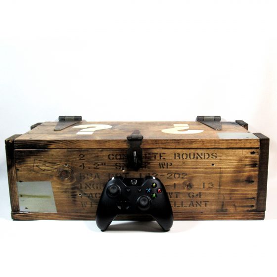 Zombies Mystery Box replica. A real life handmade CoD zombies mystery box replica shown with a controller for scale and the lid closed.