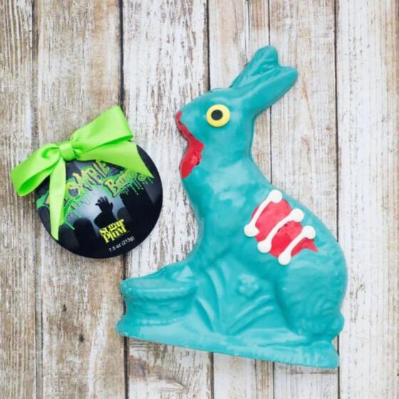 Green Chocolate Zombie Bunny with exposed ribs, red blood drips and bow and tag.