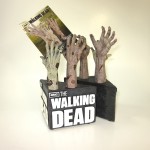 zombie walking dead hand bookends holding coa