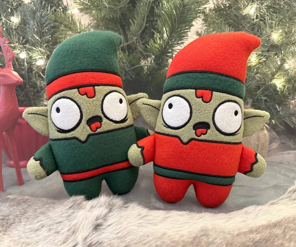 Two plush zombie Christmas elves