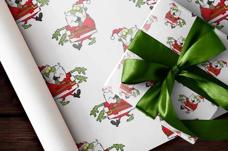 Zombie Santa wrapping paper on a gift with a large green ribbon and bow